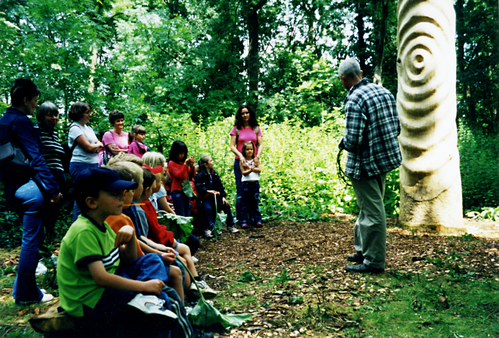 Image of: Story telling in the woods at Abbey Home Farm near Cirencester.